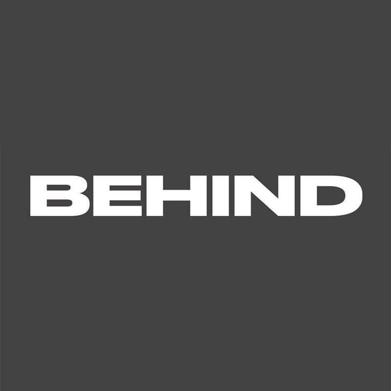 Behind