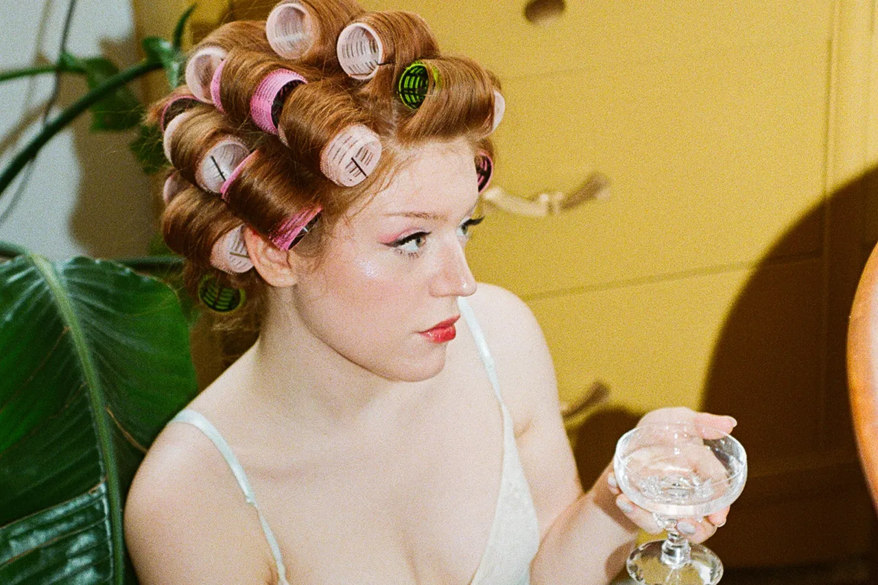 Housewife navigates health challenges, creative control and the delicate art of transformation on her glittering debut EP, 'Girl of the Hour'