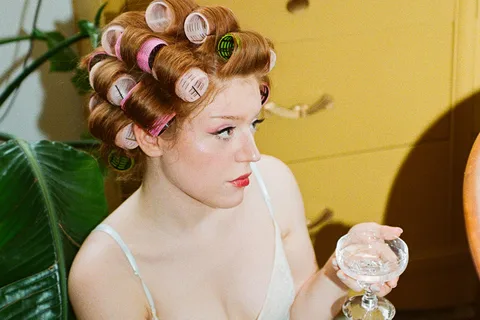 Housewife navigates health challenges, creative control and the delicate art of transformation on her glittering debut EP, 'Girl of the Hour'