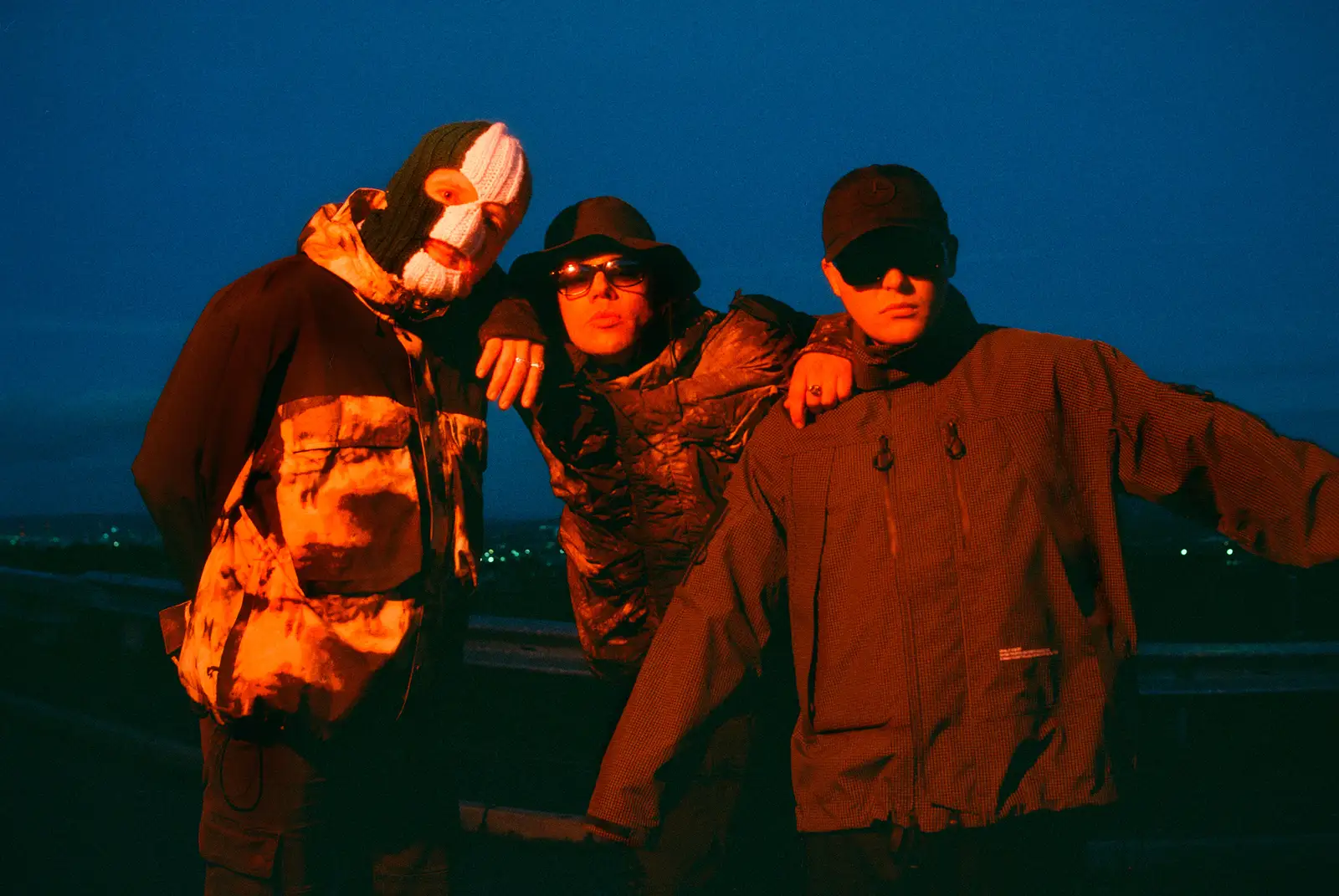 KNEECAP have shared ‘FENIAN’ and its no-holds-barred new video filmed across West Belfast