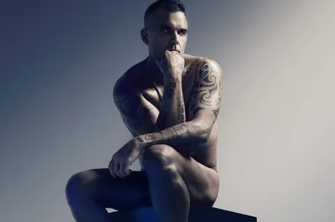 Robbie Williams still wants to play the Glastonbury legends slot for “a reimagination of what Robbie Williams”