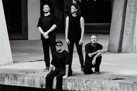 Architects battle the wind and rain for their new 'Blackhole' video