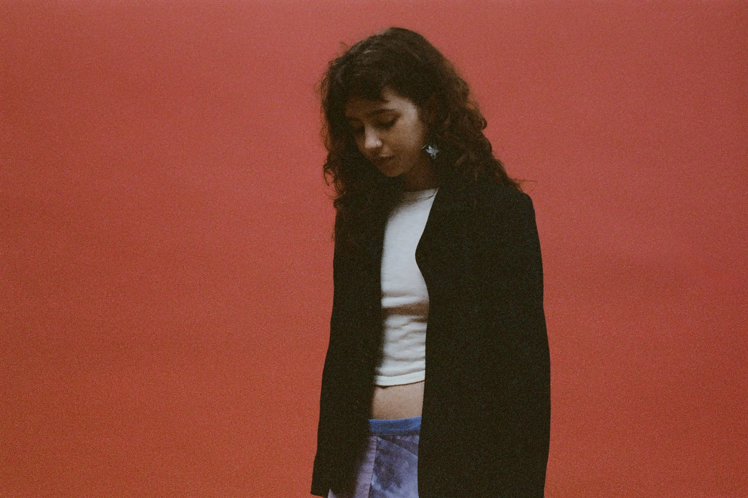 Clairo builds a campfire and befriends a Yeti in her new 'Sexy to Someone' video