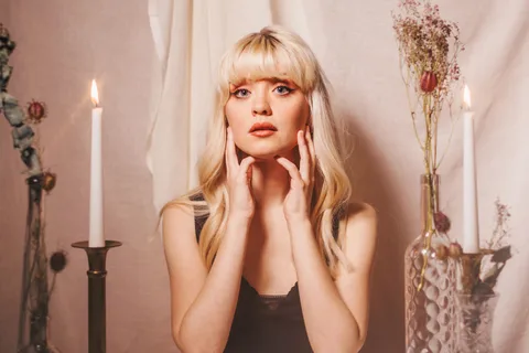 Maisie Peters has released a deluxe album featuring six new tracks: "I wasn’t finished telling certain stories"