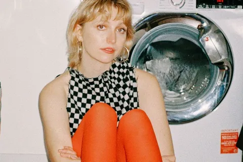 Abbie Ozard hangs out in the loo in the video for her debut album title-track, 'everything still worries me'